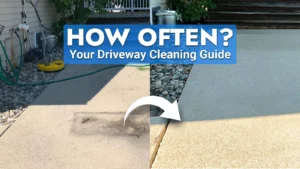 A professional using a pressure washer on a concrete driveway, illustrating the ideal driveway cleaning schedule.